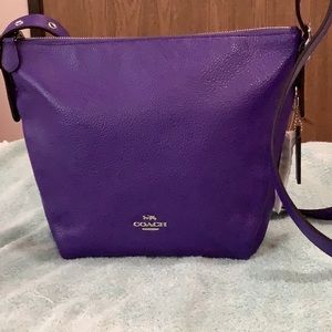 Coach violet crossbody leather bag.